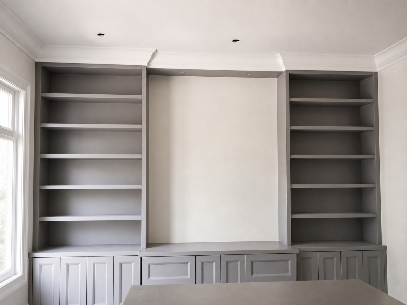 Crown moulding running along built-in cabinetry